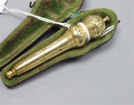 A cased 18th century turned gilt white metal needle case, 7cm.